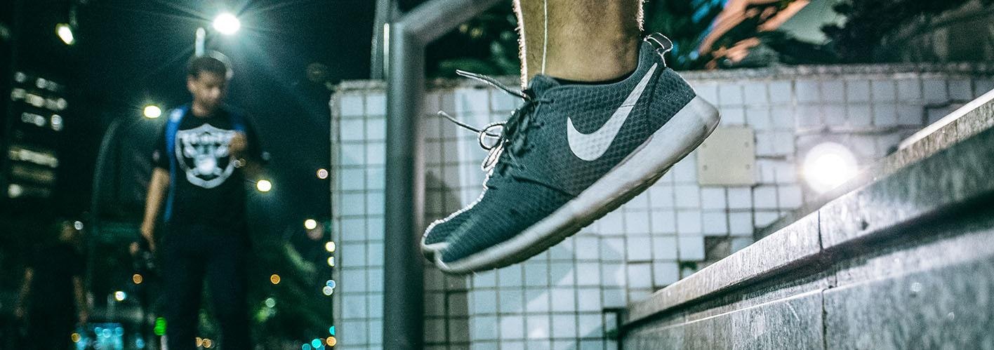 guy wearing nike shoes jumping